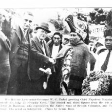 This is a black and white photograph of Walter Nichol shaking hands with Chief Maquinna.