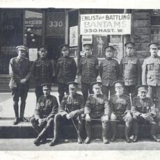 This is a black and white photograph of soldiers from a Bantam battalion on a Vancouver street probably in 1916.