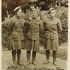 This is a black and white photograph of Frank Swannell and two other soldiers in France during the First World War.