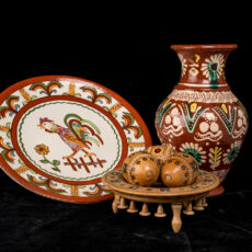 Collection of Ukrainian wood carvings including a plate and vase.