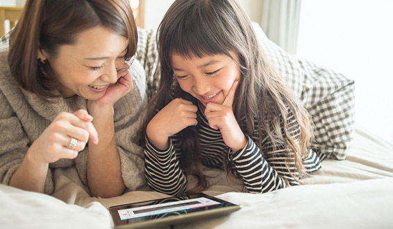 Mother and daughter using the Learning Portal website on a tablet