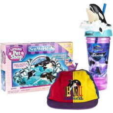 Three merchandised items for Shamu: A Littlest Pet Shop Shamu playset, a multicoloured hat and a cup with a Shamu jumping from the lid.