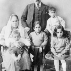 A black-and-white family portrait of Mayo Singh, his wife, Bishan Kaur, and four young children.
